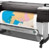 HP DesignJet T1700 44-inch large format plotter printer - front angle view with printed drawing output.