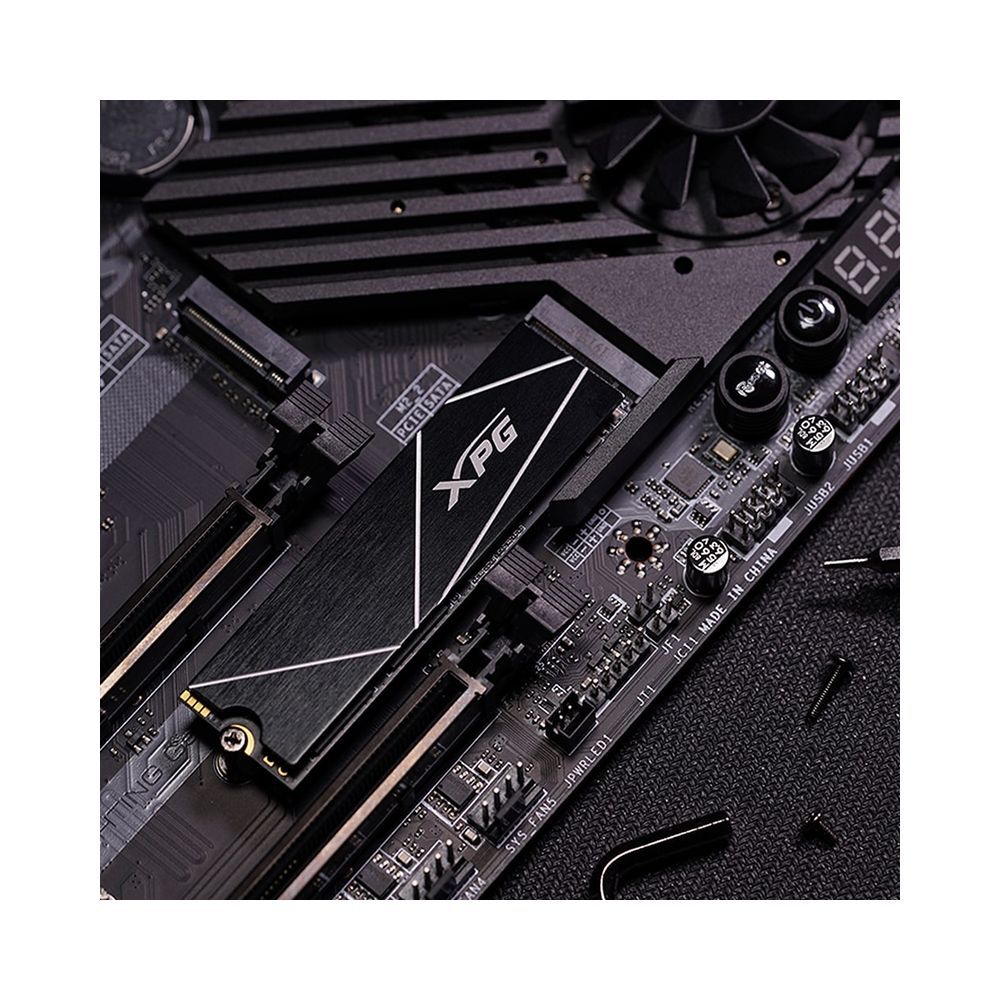 PS5 ready XPG S70 Blade installed on motherboard showing low profile heatsink fit and PCIe Gen4 performance.